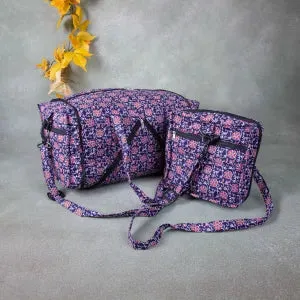 Expandable Travel Bag Blue with Red Flower Design.